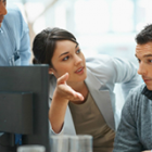 Business plan - Young business woman presenting her ideas to colleagues during a meeting